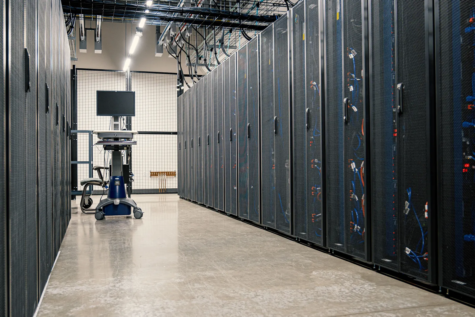 Aisle of server racks in a data centre
